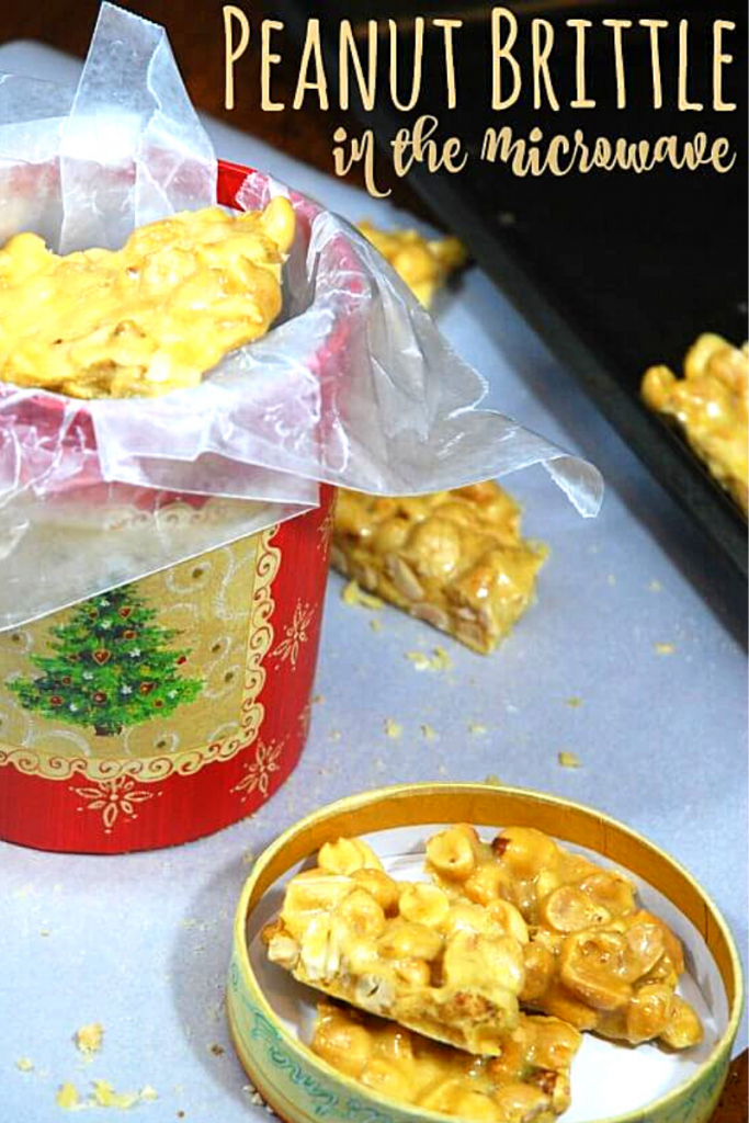 A Christmas tin full of peanut brittle for gift giving.