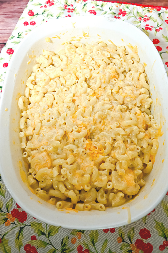 White casserole dish with the finished macaroni and cheese