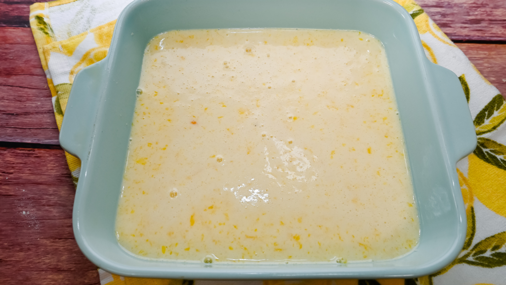 The uncooked lemon bar filling in the baking dish for Microwave Lemon Bars