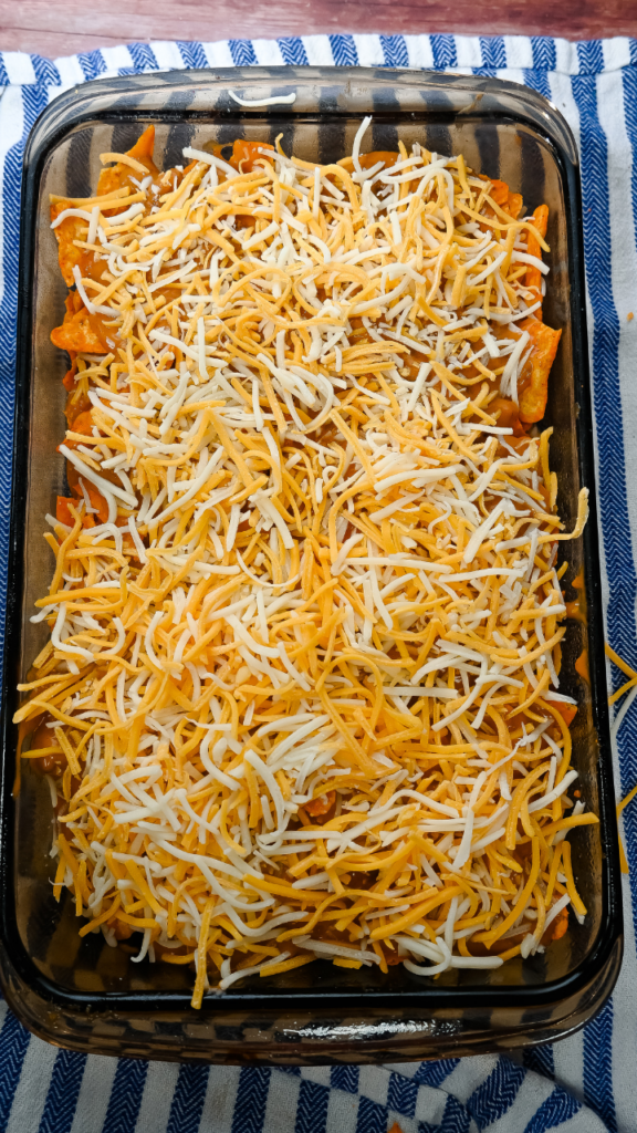 Second layer of shredded cheese layered for the Dorito Casserole in the Microwave