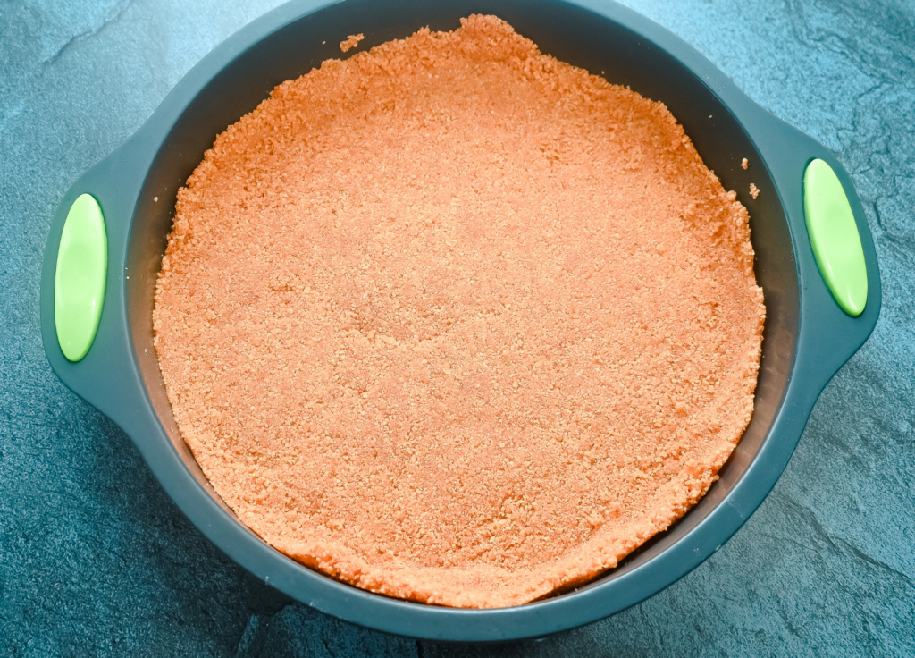 The graham cracker crust pressed and cooked in the microwave for a plain cheesecake. 