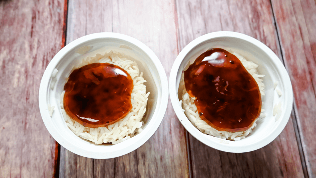 Two cups of basmati Minute Ready Rice with teriyaki sauce poured over them. 
