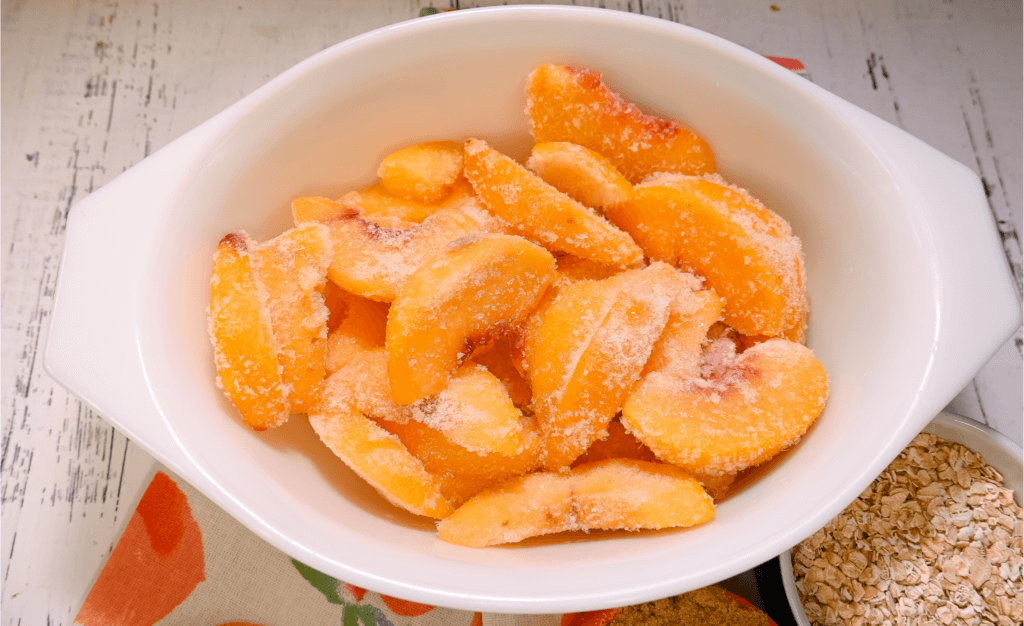 Frozen peaches in a microwave safe bowl