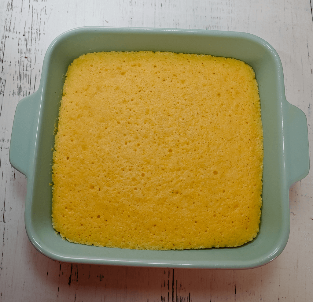 Light blue casserole dish with finished cornbread