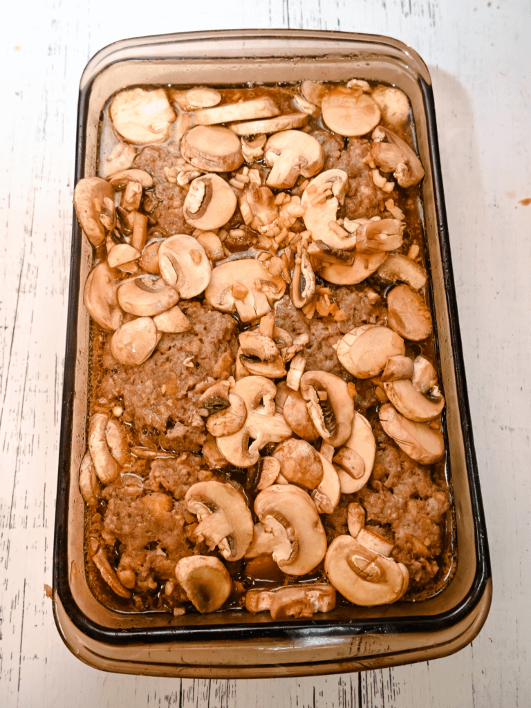 The cooked salisbury steaks with the soup mix poured over the top. 