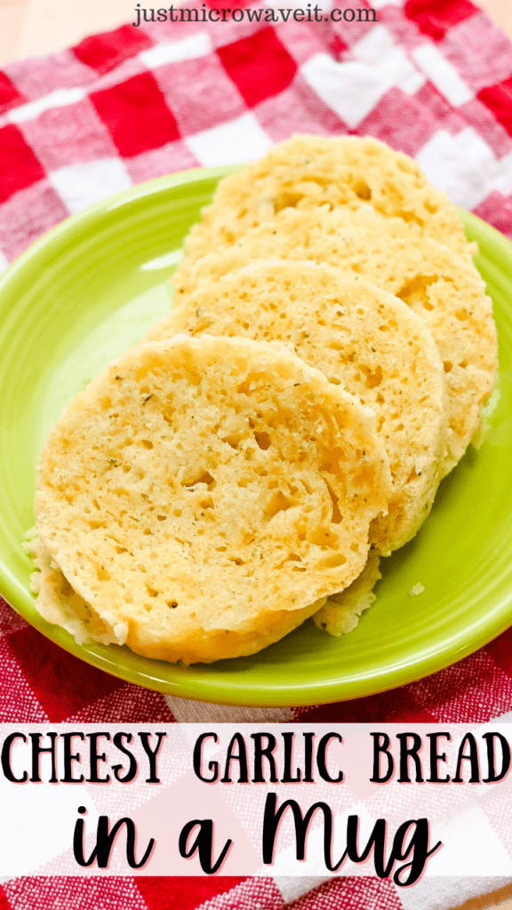 Close up of sliced Cheesy Garlic Bread in a Mug on a green plate sitting on a red checked napkin