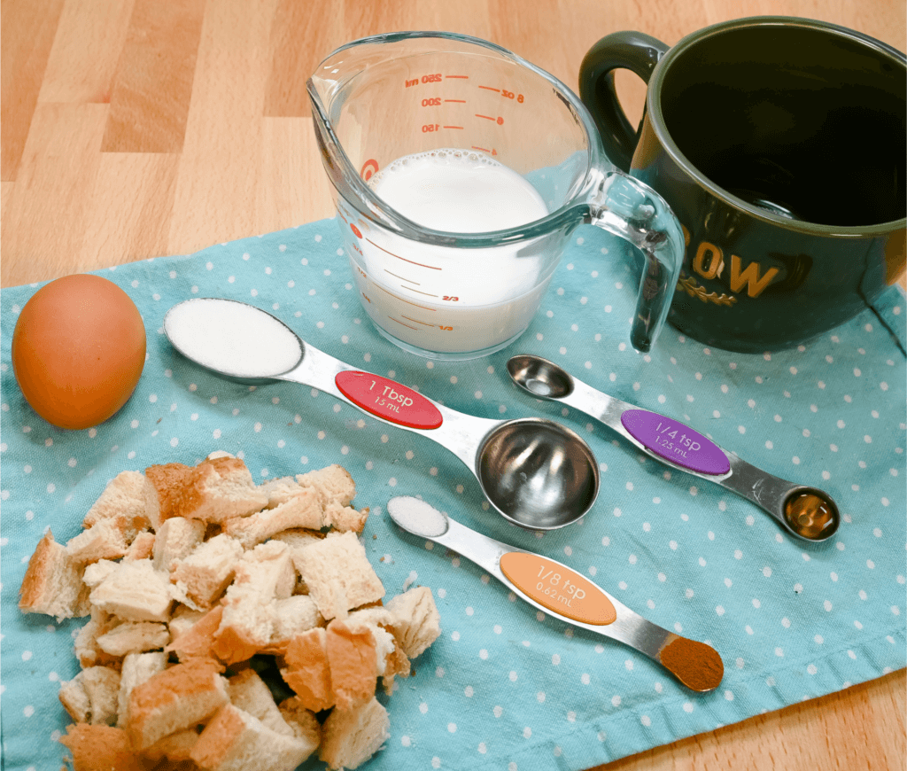 Ingredients to make French Toast Casserole in a Mug on a blue polka dotted napkin
