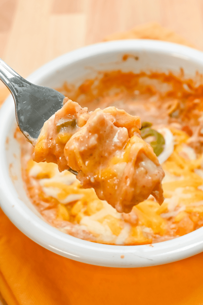Close up of king ranch chicken in a white bowl. 