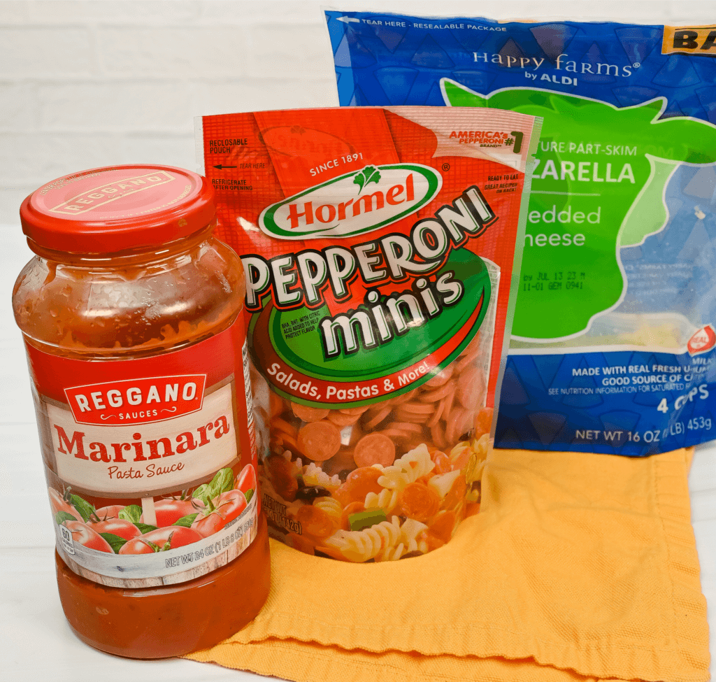 Ingredients to make pepperoni pizza dip