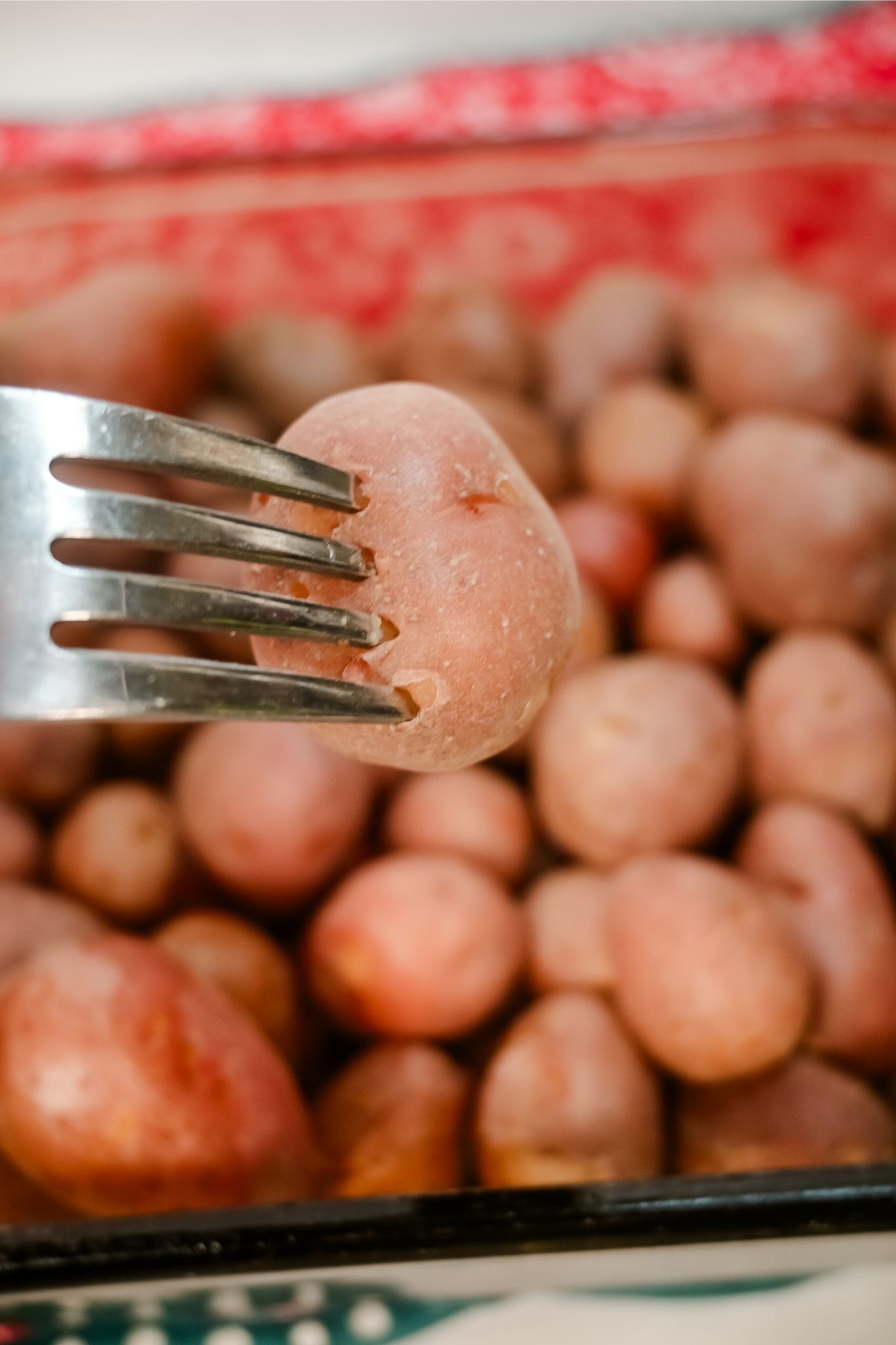 The baby potatoes are done when they're fork tender. 